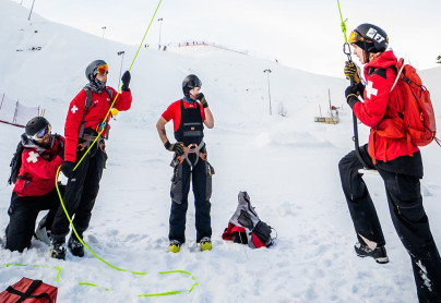 Ski patrol performing safety tests on a chairlift at winsport